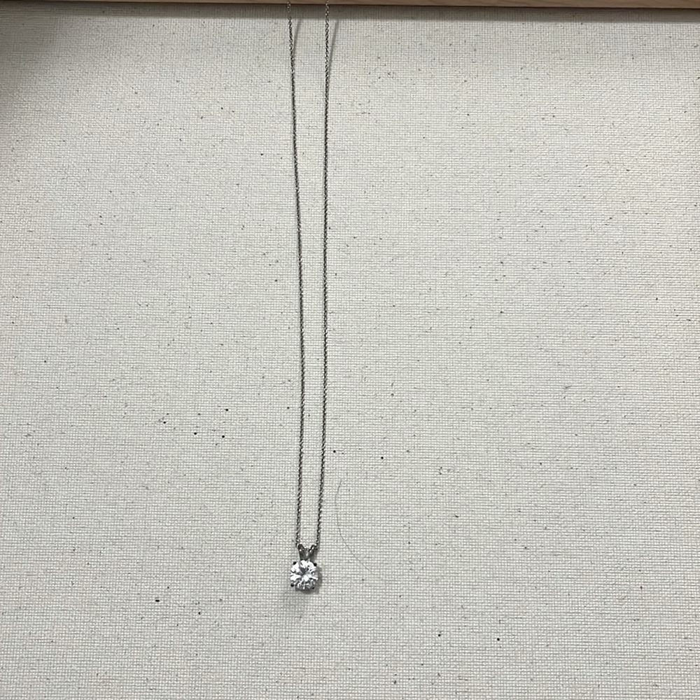 silver necklace with diamond charm